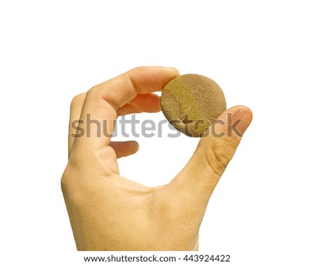 Hand holding a little stone photo over white background