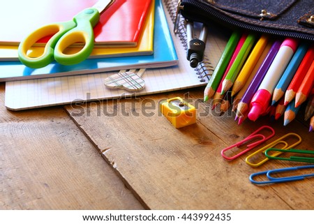 Back to school concept. Writing supplies on the table.