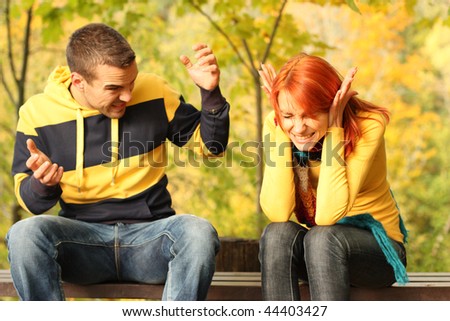 Young pair quarrel in park Royalty-Free Stock Photo #44403427