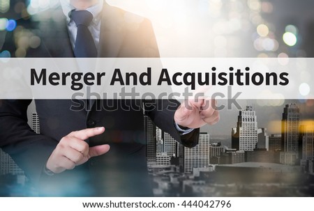 M&A (MERGERS AND ACQUISITIONS) and businessman working with modern technology