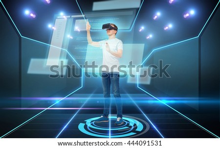 3d technology, virtual reality, cyberspace, programming and people concept - happy young man in virtual reality headset or 3d glasses working with coding on screen over dark background and laser light