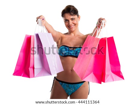 Woman in bikini with many shopping bags