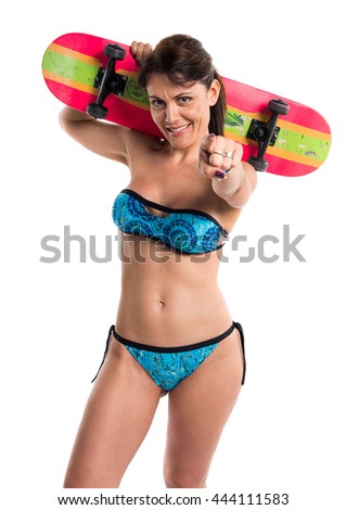 Woman in blue bikini with skate