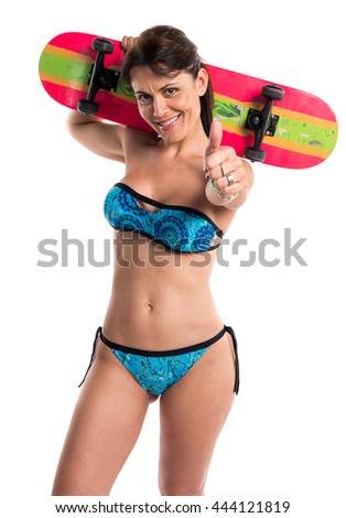 Woman in blue bikini with skate