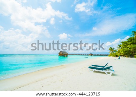 Beautiful tropical beach and sea with coconut palm tree on blue sky in Maldives island - Boost up color Processing
