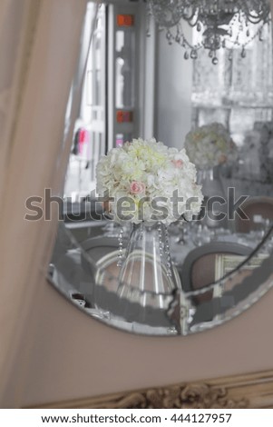 Picture of white flowers on table in vase