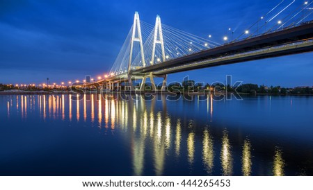 Bolshoy Obukhovsky Bridge at the morning light, calm water, lights, lamps, white nights, Saint-Petersburg, Russia Royalty-Free Stock Photo #444265453