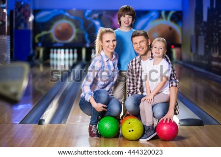 Happy family at bowling