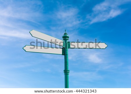 Blank Road Sign on Blurry Blue Sky And White Clouds Background with Clipping Path