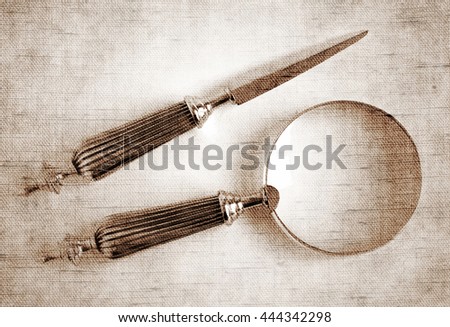 Sepia toned Antique Silver Loupe and Letter Opener - Photo made with canvas texture effect                              
