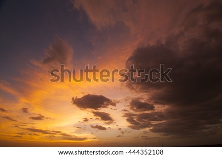 Colorful sky and clouds at Sunset, background of dramatically dark storm clouds. Colorful Sky with dark grey cloud before rain.