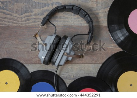 Old vinyl records and headphones on the table