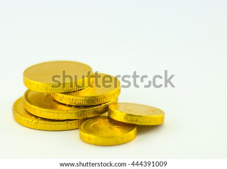 Chocolate gold coins isolated on white background.copy space and selective focus