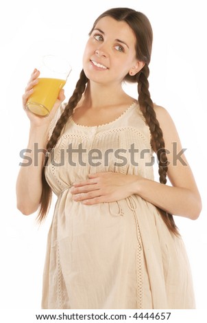 The pregnant female on a white background & orange juice
