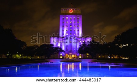 Houston, Texas City Hall building lit up at night with reflecting pool