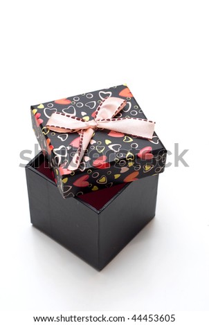 hand-made opened black gift box with hearts shape in white background