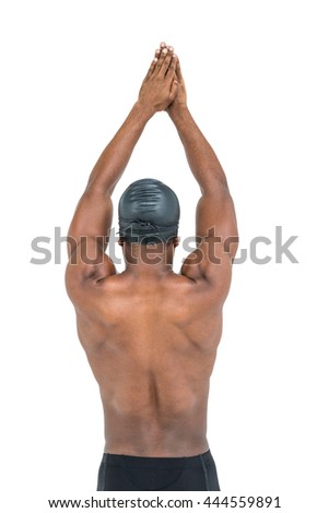 Rear view of swimmer ready to dive on white background
