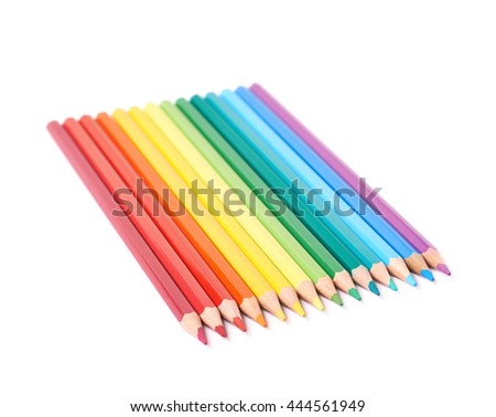 Multiple colorful color pencils composition arranged in a line to form a rainbow gradient, composition isolated over the white background
