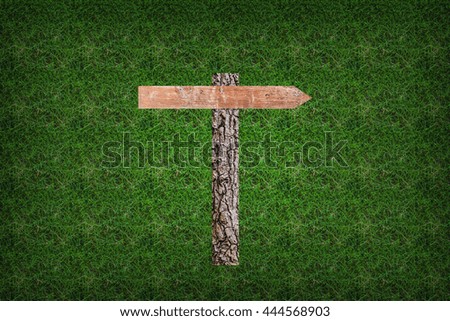 Wood sign on grass background