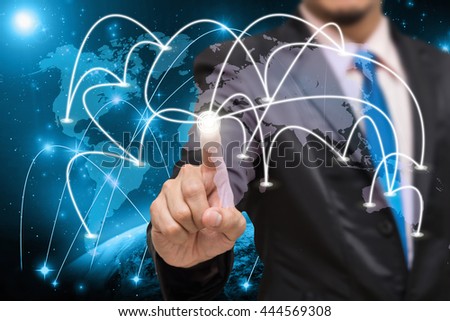Businessman touching the center point of connection line of global network on world map with Part of earth network line background, business connection concept,Elements of this image furnished by NASA