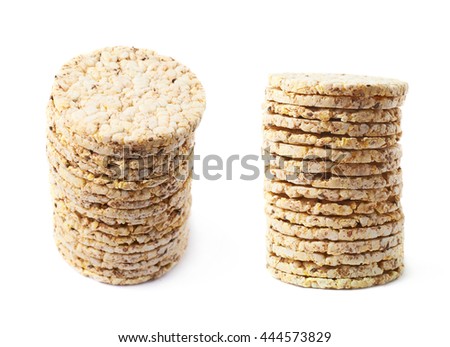Pile stack of diet rice crackers isolated over the white background, set of two different foreshortenings