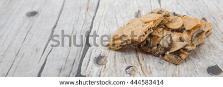 Homemade florentine biscuits over wooden background