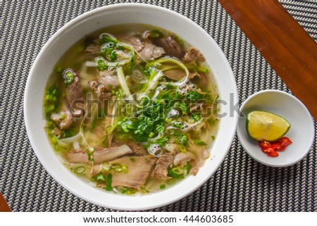 rice noodle soup with sliced beef Royalty-Free Stock Photo #444603685