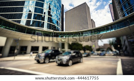 Traffic and office buildings in downtown Houston, Texas during the day