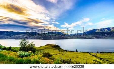 Sunset over Kamloops Lake along the Trans Canada Highway in British Columbia, Canada Royalty-Free Stock Photo #444620338