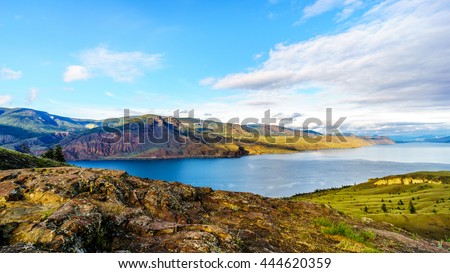 Sunset over Kamloops Lake along the Trans Canada Highway in British Columbia, Canada Royalty-Free Stock Photo #444620359