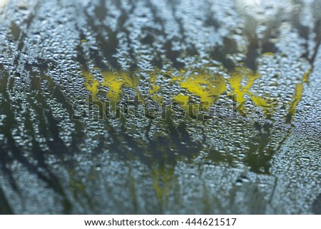 A morning dew or frost on a car windscreen.