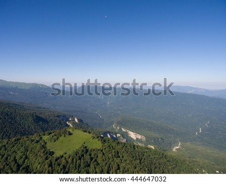 Aerial photos. The mountain ridge covered with forest. Mountain landscape. Caucasus.