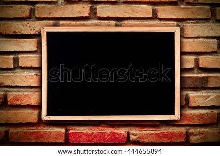 blackboard on white background with old dirty brick wall background