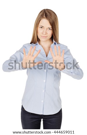 Portrait of woman making stop sign. image on a white studio background. Negative human emotion expression and lifestyle concept


