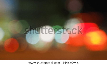 Background Bokeh red and green blur on the road are circle shape lighting.