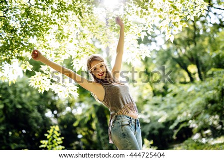 Beautiful smiling blonde hippie in nature