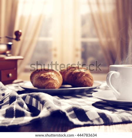 window background and coffee and cakes and napkin on wooden old table 
