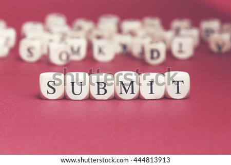 Submit word written on wood cube with red background