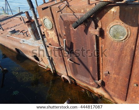 Retro antiques for the economy and transport rusty boat on the river