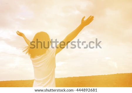 silhouette of happiness woman stays outdoor with sky background,cheering woman hiker open arms