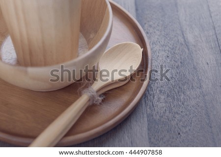 Wood kitchen utensils over grunge wooden table background