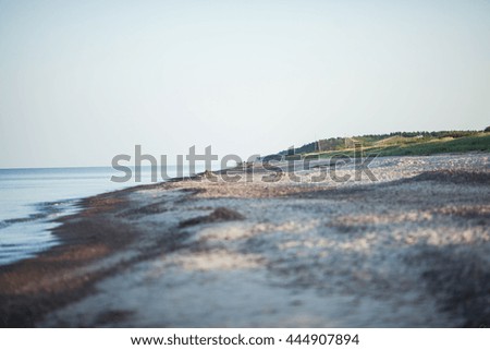 Baltic sea shoreline with small waves in water