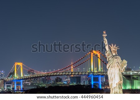 Statue of Liberty with Rainbow Bridge, Tokyo Tower and Tokyo City in Background at Night