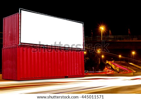 billboard blank on red container box for outdoor advertising poster at night time for advertisement over blurred city street night light background.