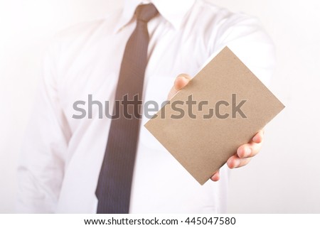 Hand hold blank plain kraft business card design mockup.