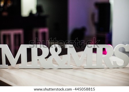 beautifully decorated interior restaurant for wedding of young couple, symbols