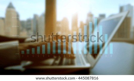 computer screen showing business charts diagrams in modern office building. analyzing financial growth investment strategy. city skyline background  