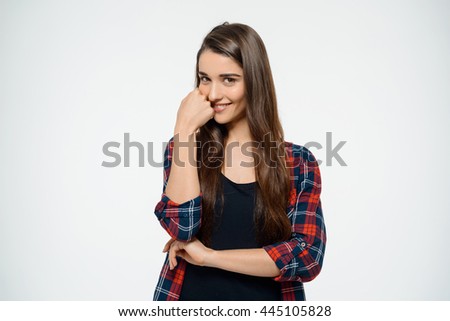 Cheerful young girl posing over white background