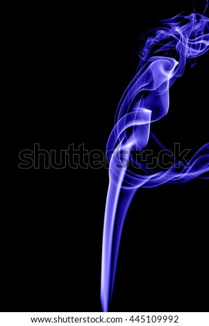 Abstract blue smoke on black background from the incense sticks