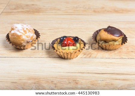 Pictured pastries on light wood background.